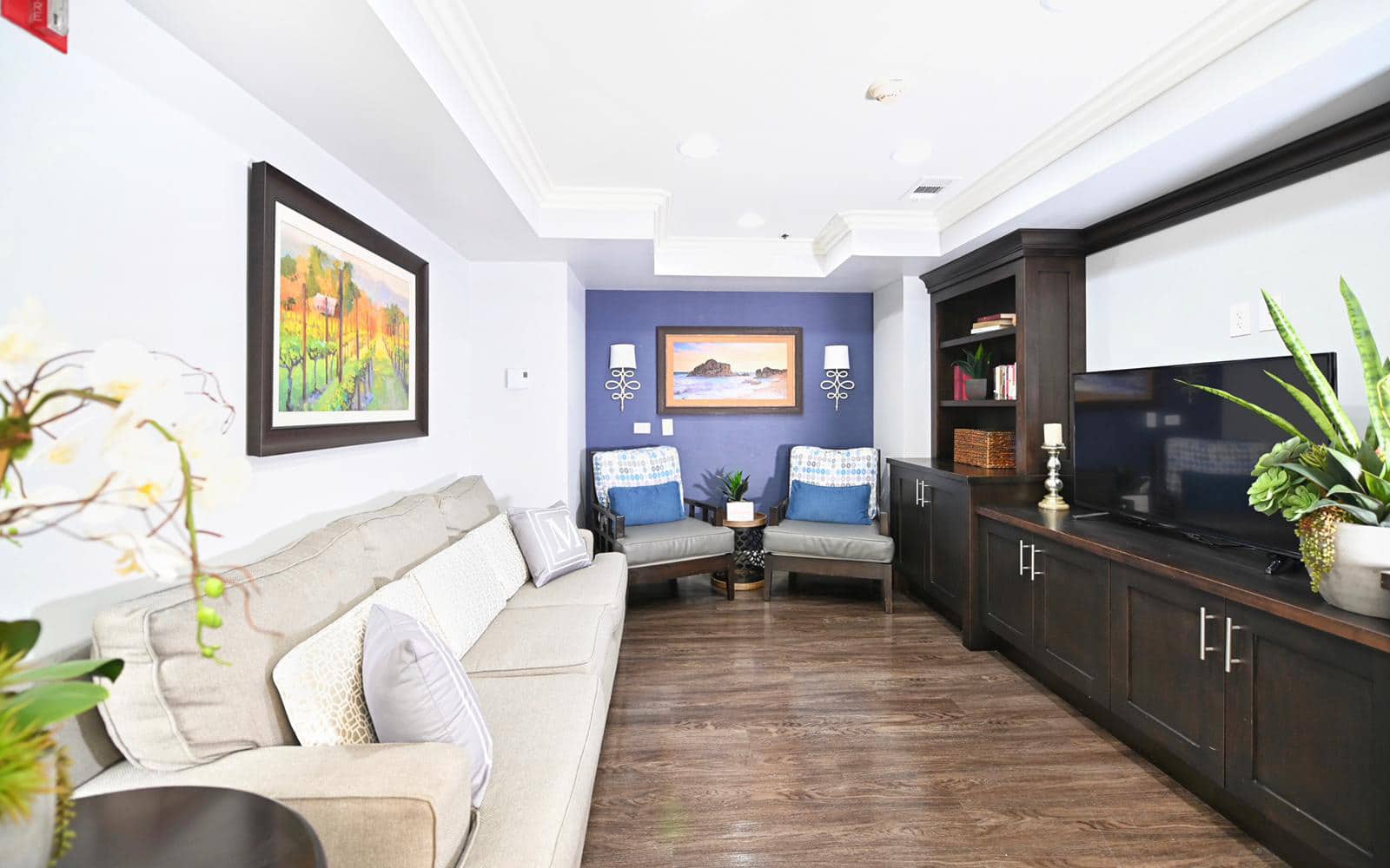 Mclure recreation room, elegantly decorated with modern furniture and electronics